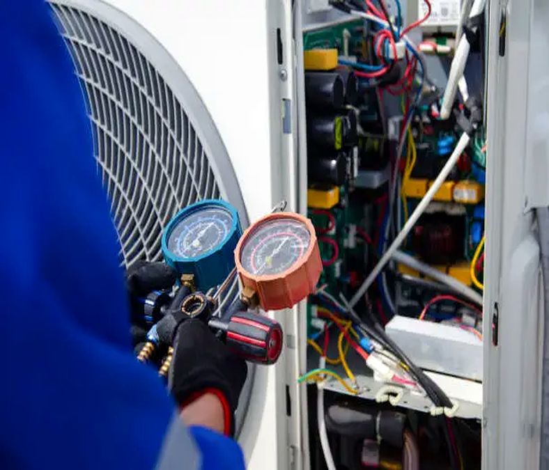 An AC technician analyzing air conditioner condition in Smyrna properties)