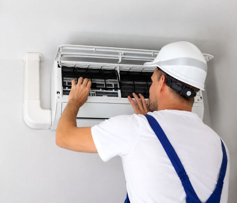 Expert reviewing an AC for air conditioner repair in MT. Juliet, TN