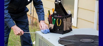 HVAC technician inspecting an air conditioner during professional AC repair in Smyrna, TN