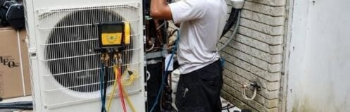 HVAC technician performing air conditioning repair in Murfreesboro TN on a residential AC system.