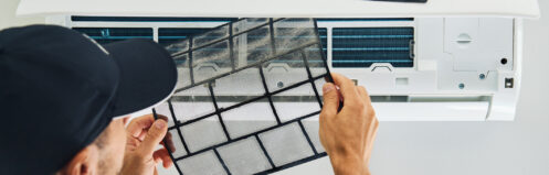 HVAC technician changing mini-split filter